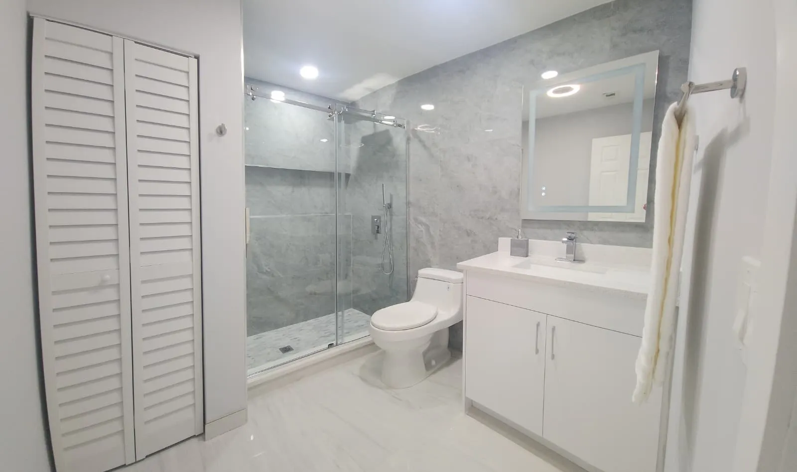 Large-format marble-look tile shower