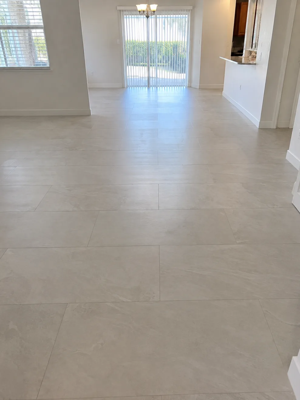 Large-format porcelain tile flooring after the Vetromani installation