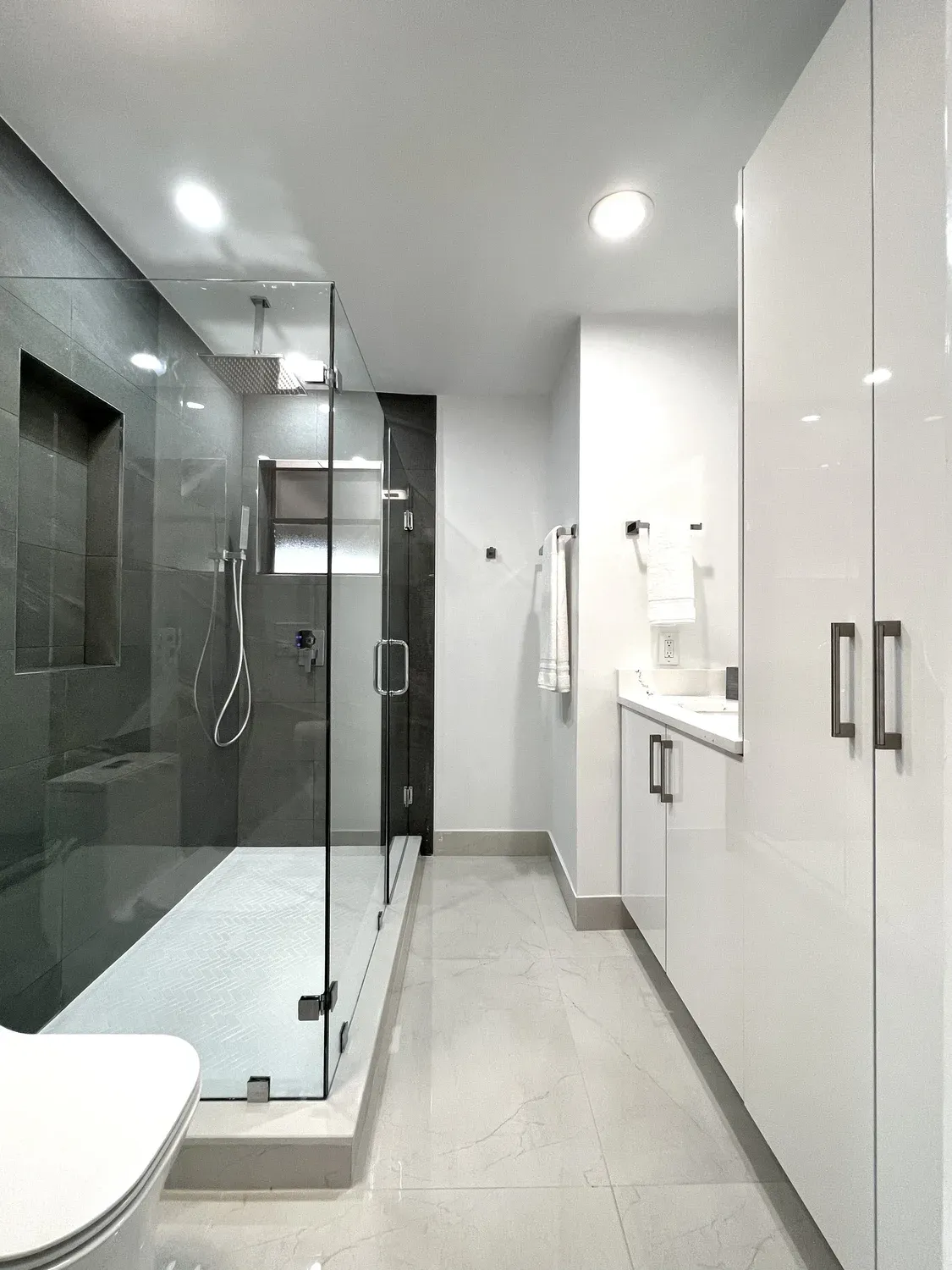 Dark Tile Shower with Gloss Vanity