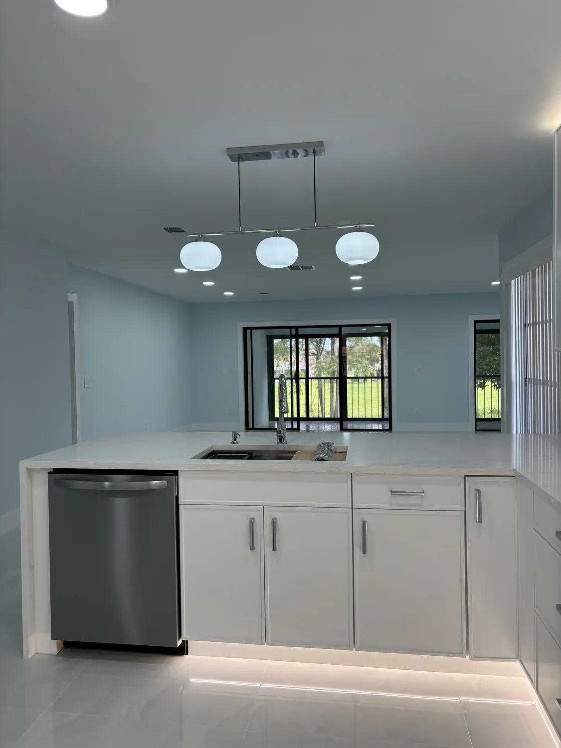 White Kitchen with Globe Pendants
